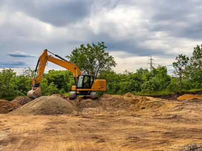 excavator working on a cleared land site