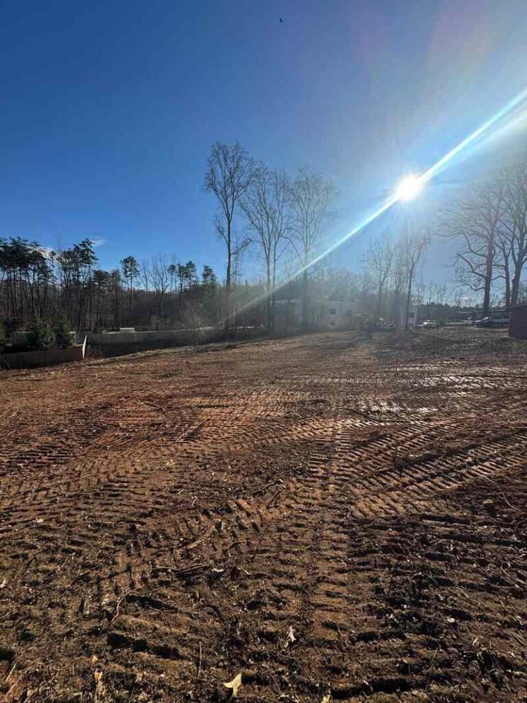 Cleared and graded residential lot after house demolition in Charlotte NC