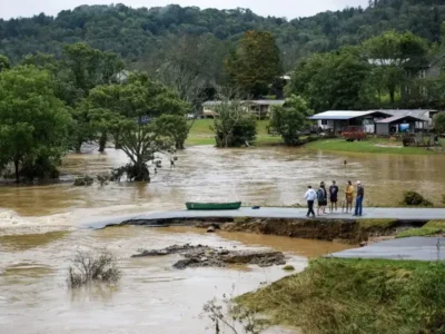 Flooded road and nearby homes showing flood zone risk before a demolition or rebuild decision